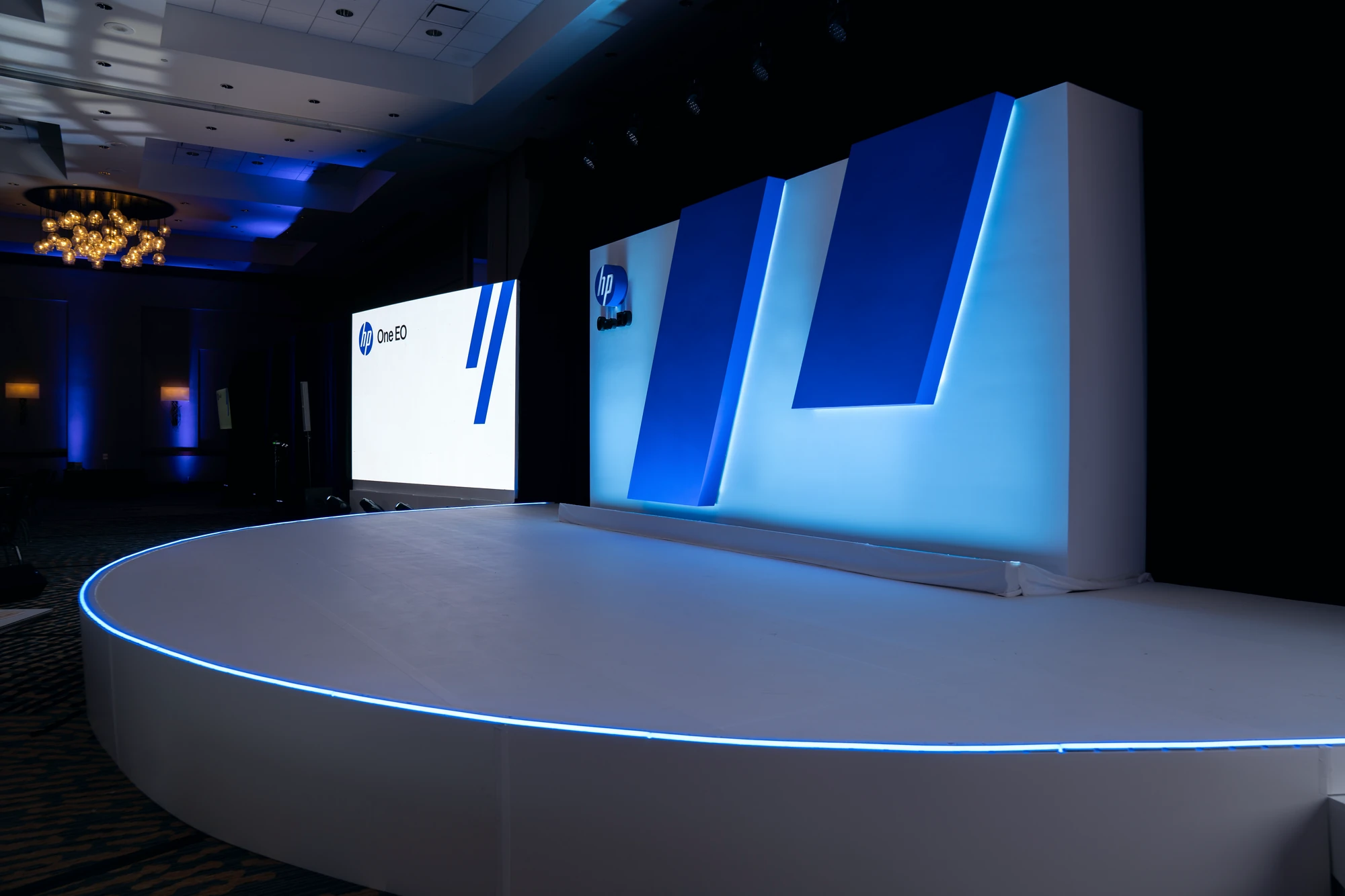 Custom half-circle stage and LED walls at a technology executive summit