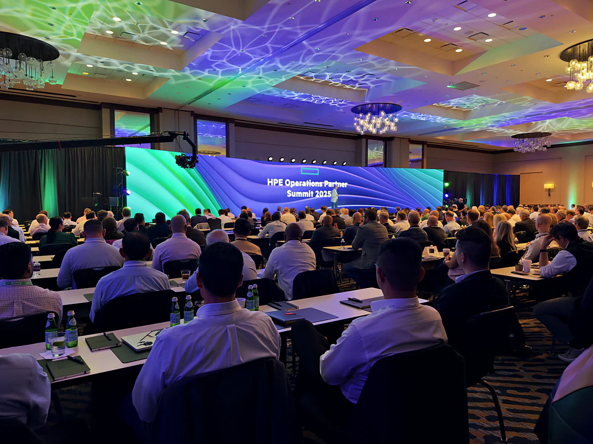Packed ballroom general session with curved LED and IMAG on both flanks